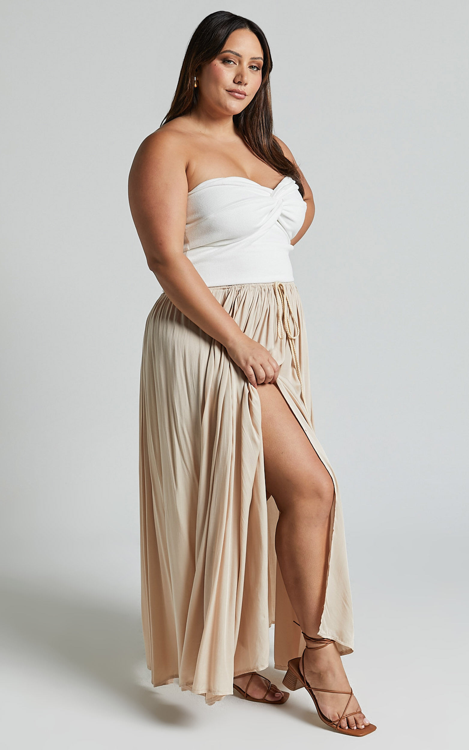 White flowy 2025 skirt underneath