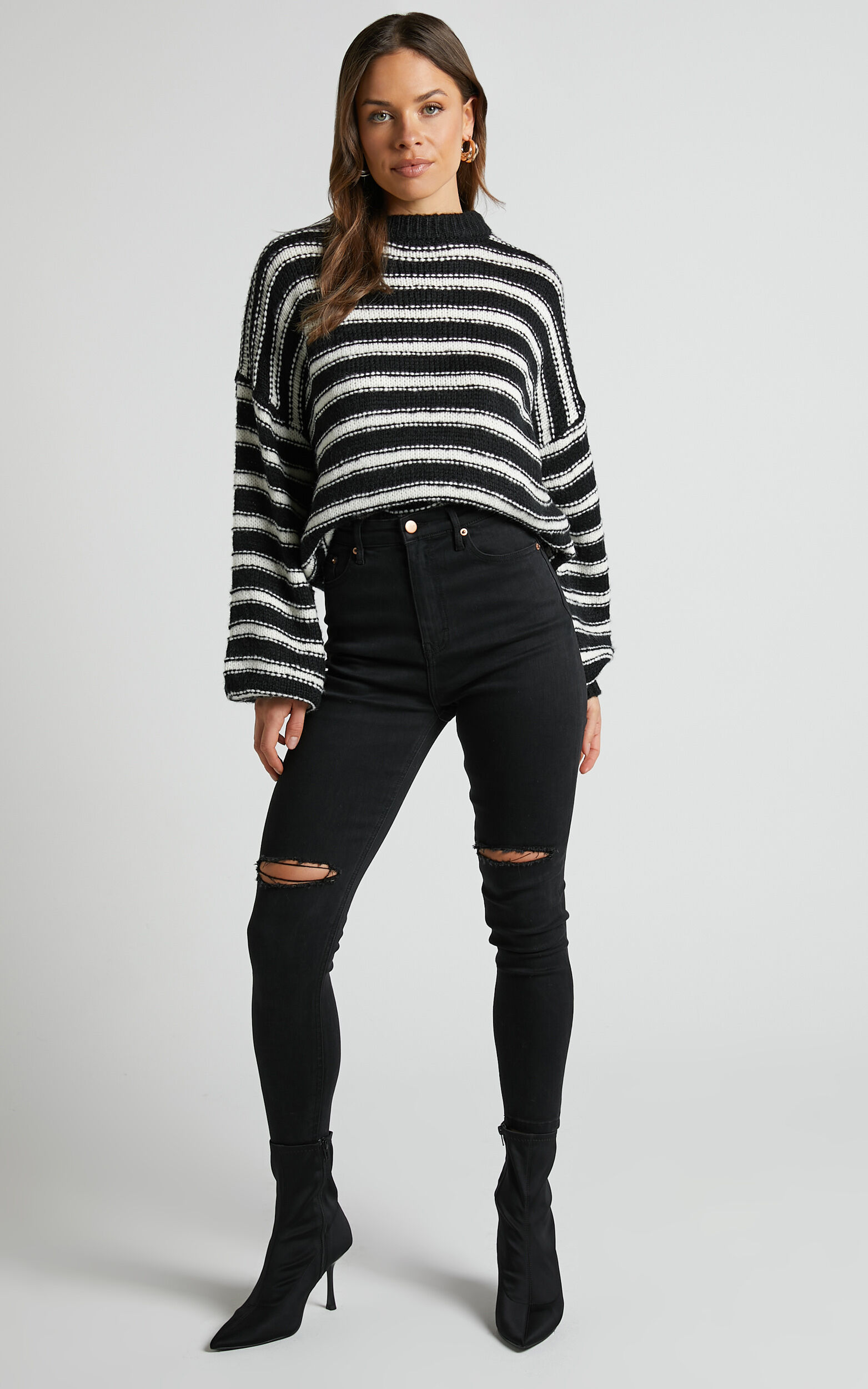 Black jumper with white stripes on sleeve online