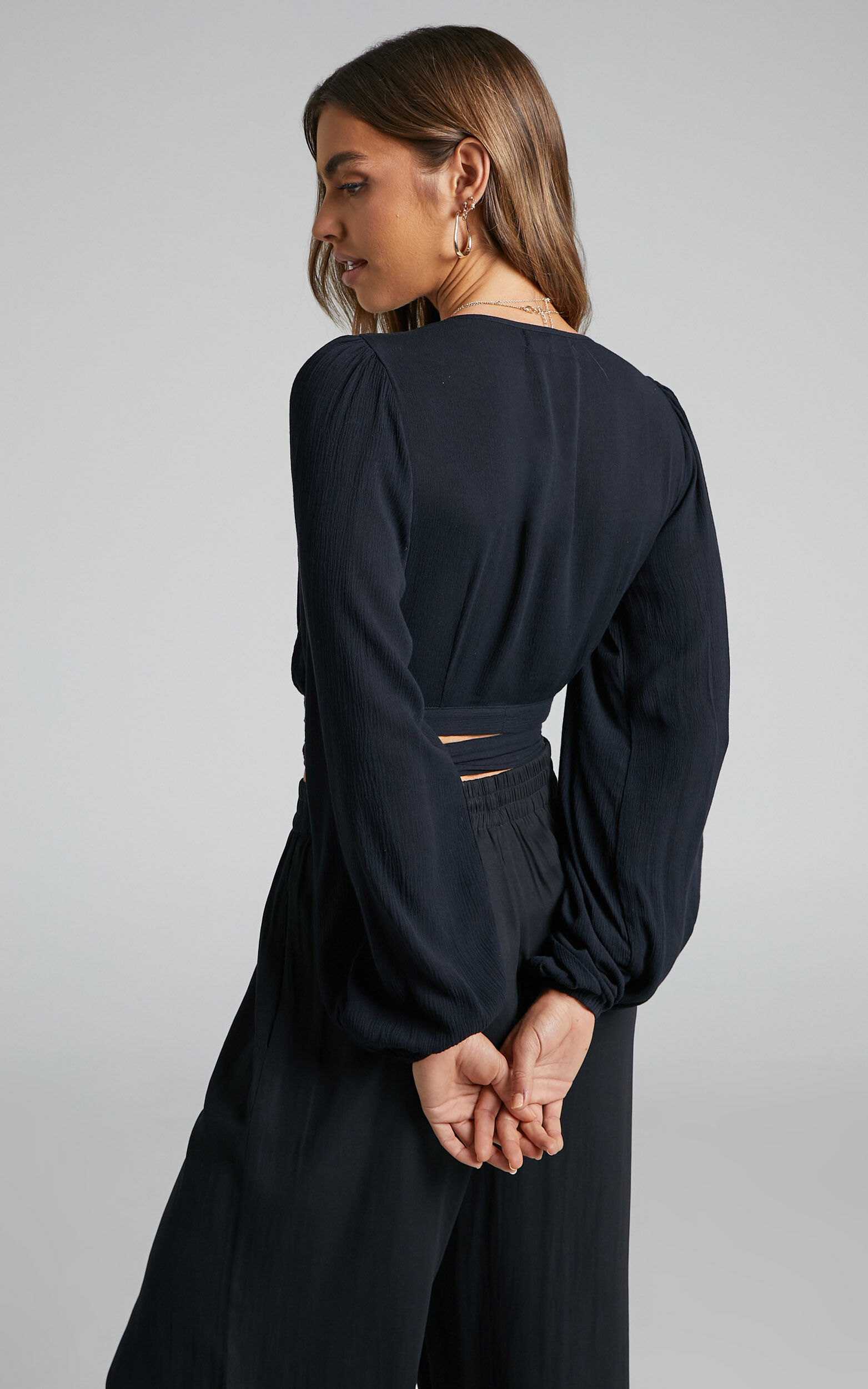 Amaina Top - Plunge Long Sleeve Wrap Top in Black | Showpo USA