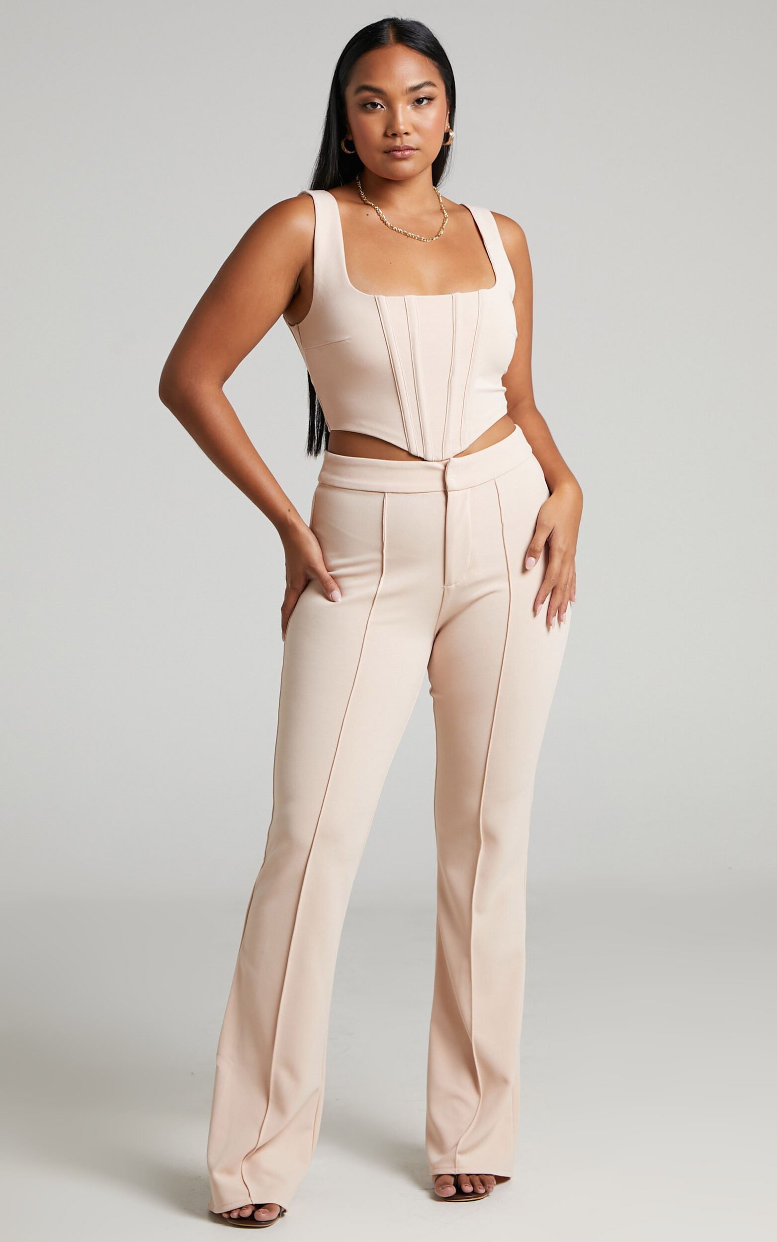 https://images.showpo.com/dw/image/v2/BDPQ_PRD/on/demandware.static/-/Sites-sp-master-catalog/default/dw1f4227e8/images/ritta-two-piece-pant-set-with-corset-top-SC21080017/3_-_Ritta_Two_Piece_Pant_Set_with_Corset_Top_in_Cream_2528SC21080017022529_2.jpg?sw=1563&sh=2500