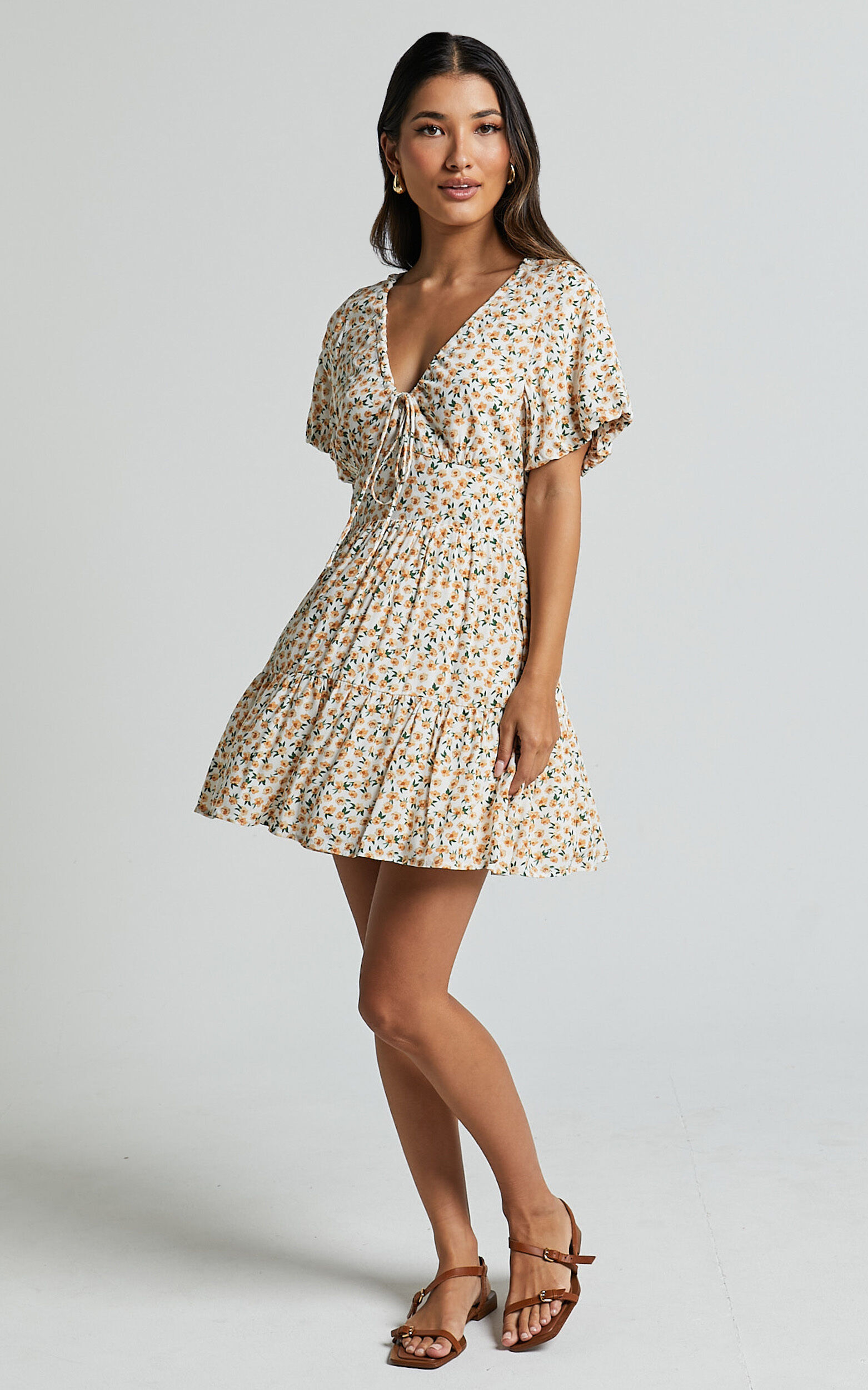 Chetana Mini Dress Tie Front Short Sleeve Tiered Dress in White and Yellow Floral Showpo