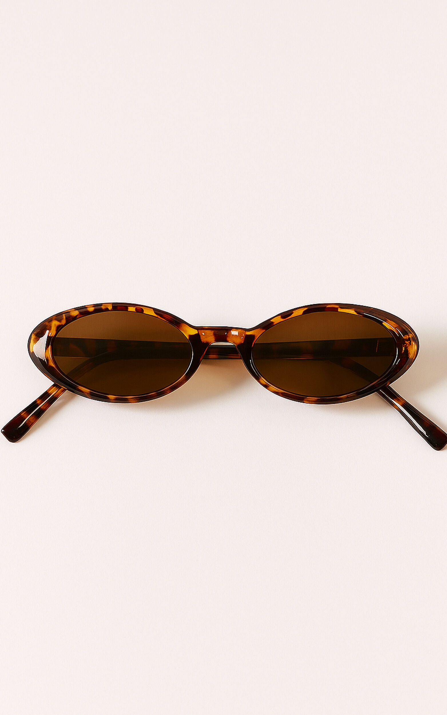 Ezra Thin Oval Sunglasses in Tort | Showpo USA