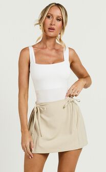 Camilla Mini Skirt - Mid Waist Pleated Back Bow Detail Skirt in Stone
