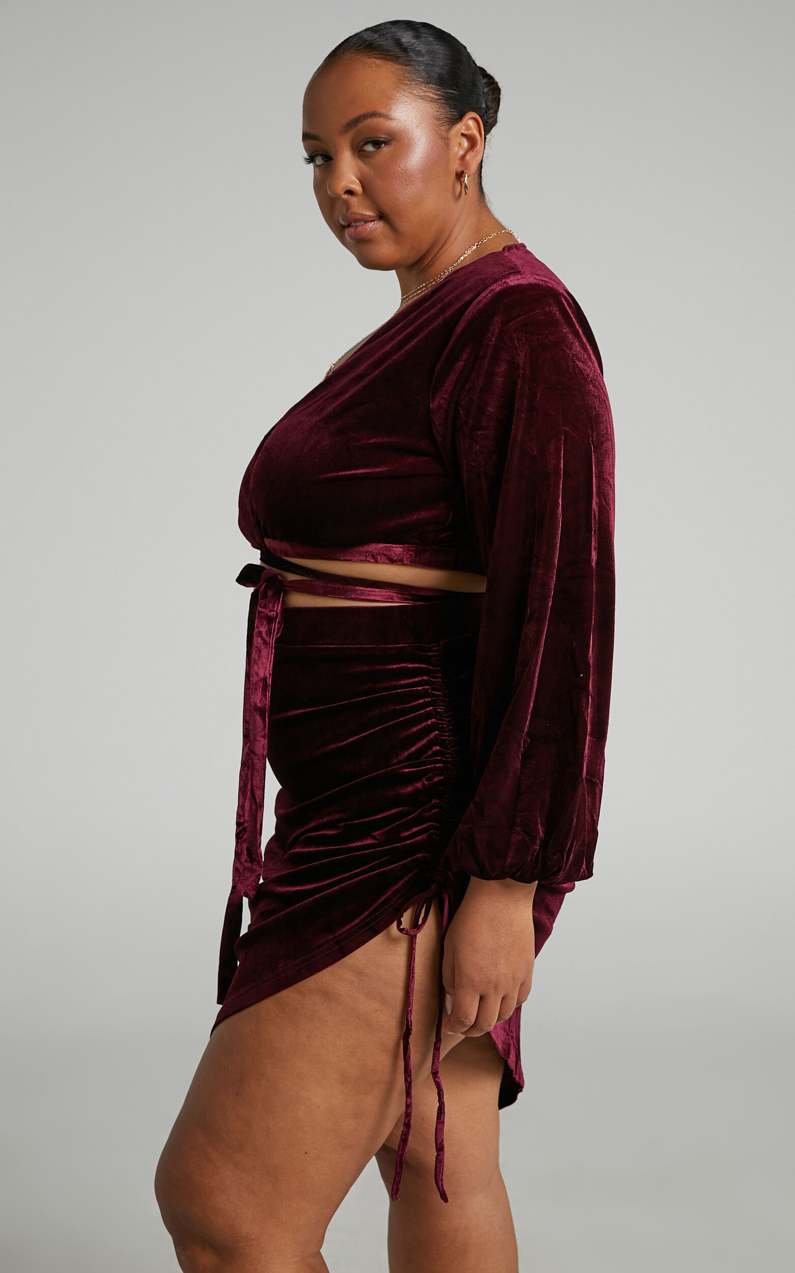Maybelyn Mini Skirt Velvet Ruched Asymmetric Skirt in Burgundy Showpo NZ