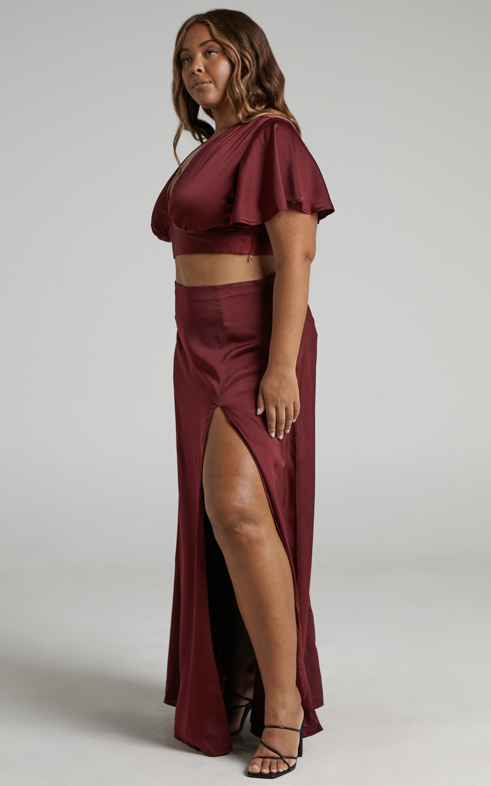 Kelcie Two Piece Set V Neck Flutter Sleeves Crop Top and Thigh Split Maxi Skirt Set in Wine Showpo
