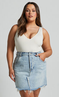 Pieta Mini Skirt - Recycled Cotton Raw Hem Denim Skirt in Mid Blue Wash
