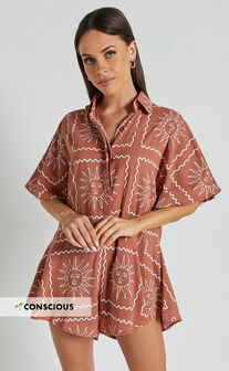 Amarie Playsuit- Short Sleeve Relaxed Button Up Playsuit in Rust Sun Print