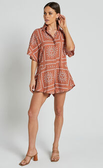 Amarie Playsuit- Short Sleeve Relaxed Button Up Playsuit in Rust Sun Print