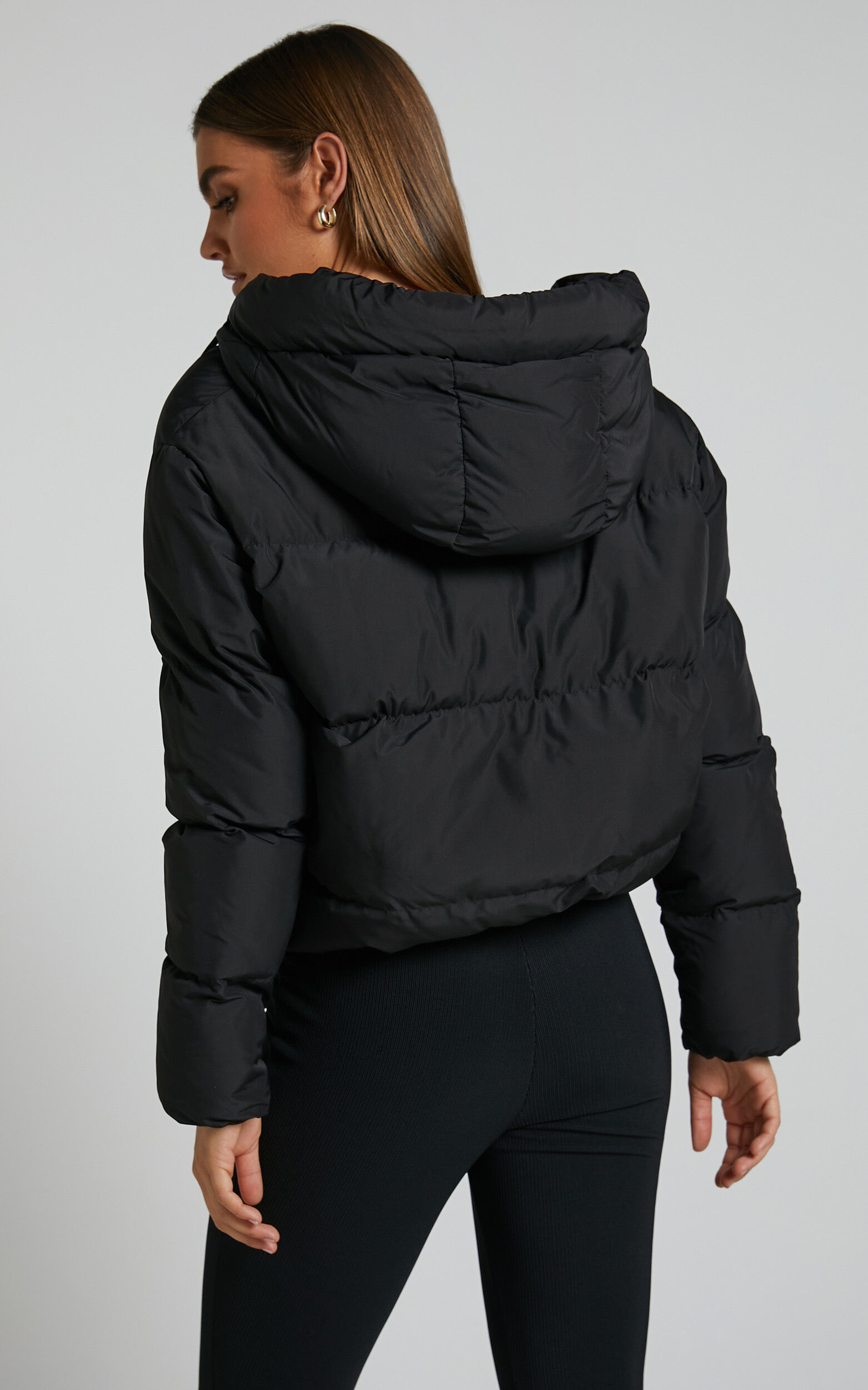 Black hooded puffer jacket with shop funnel neck
