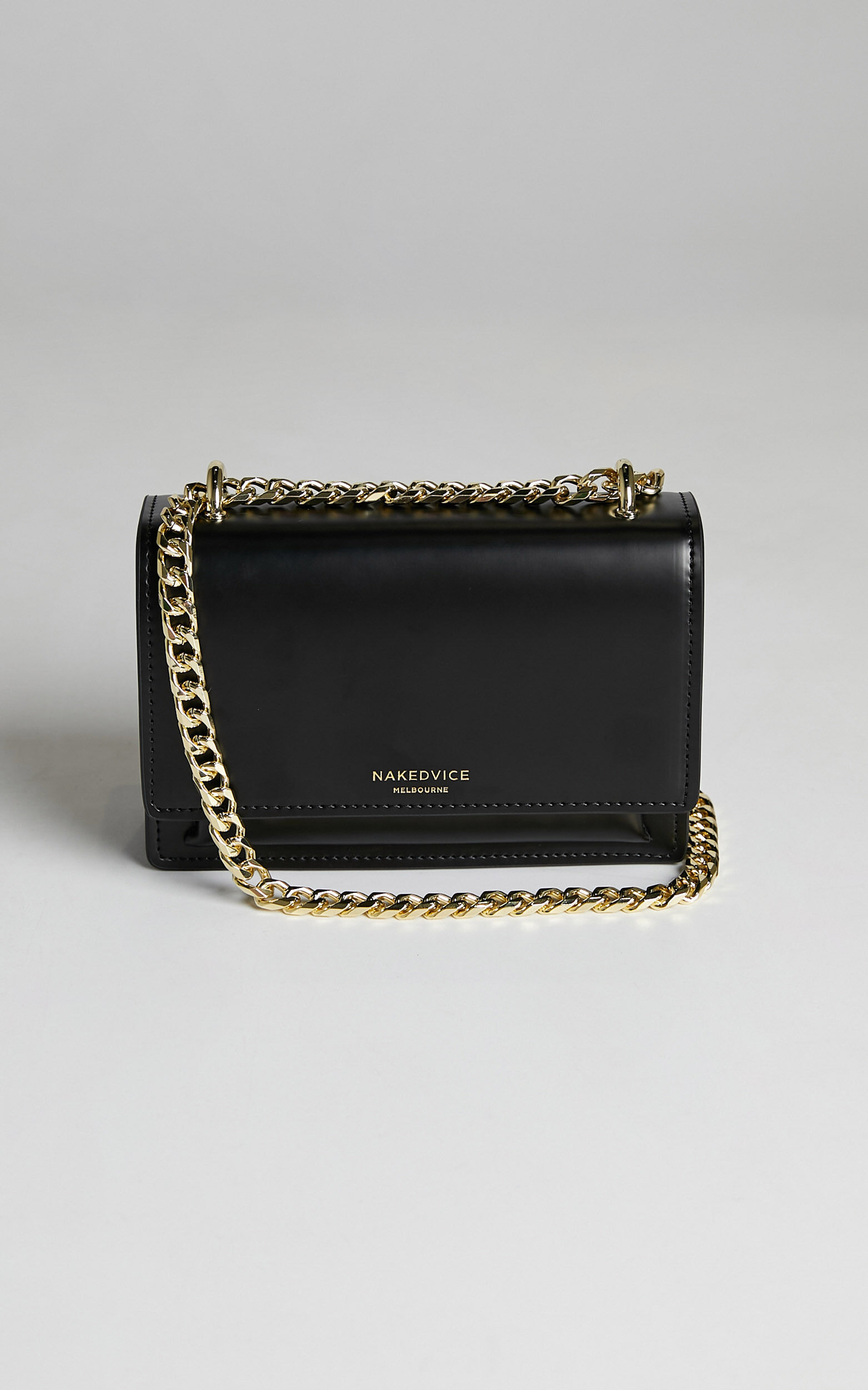 NAKEDVICE THE REGIS BAG in Black gold Showpo
