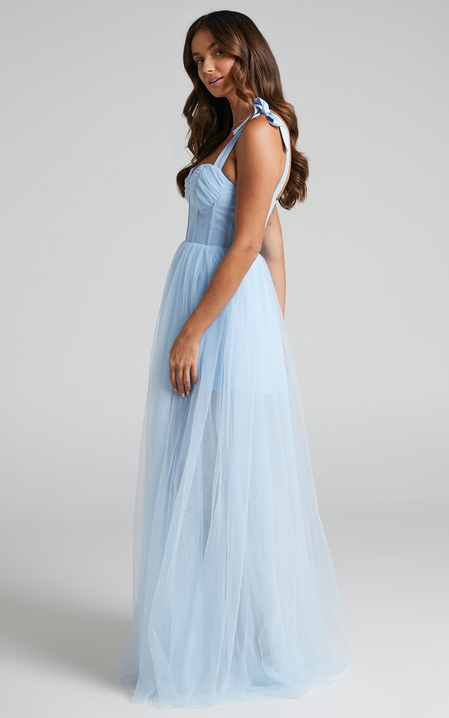 https://images.showpo.com/dw/image/v2/BDPQ_PRD/on/demandware.static/-/Sites-sp-master-catalog/default/dwd2b84643/images/emmary-tulle-maxi-gown/6_-_Emmary_Bustier_Bodice_Tulle_Gown_in_Pale_Blue_2528SD21100090032529_5.jpg?sw=1563&sh=2500